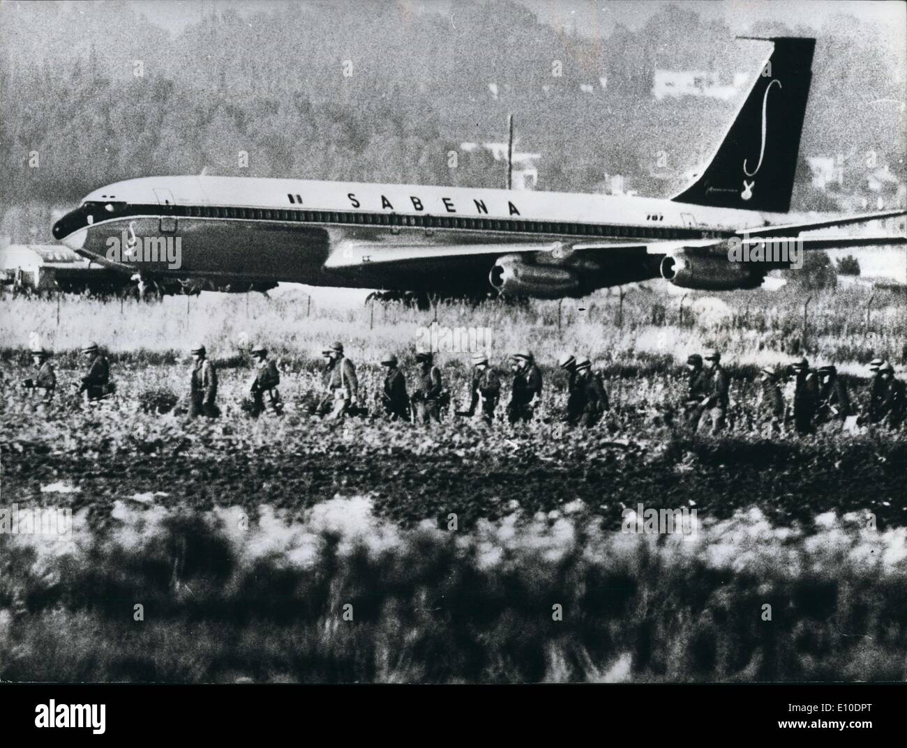 May 05, 1972 - Passengers Safe on Hijacked Plane : Israeli soldiers stormed four Arab commandos aboard the hijacked Sabena Airlines Boeing 707 airliner at Tel Avin airport, and shot and killed two of them. Two male terrorists died instantly. One girl hijacker was seriously injured and another girl captured. Both were carrying grenades. Only six of the 90 passengers were hurt and two soldiers were injured. The jet was seized on soldiers were injured. The jet was seized on Monday night after leaving Vienna, a stopping point on the flight from Brussels of Tel Aviv Stock Photo