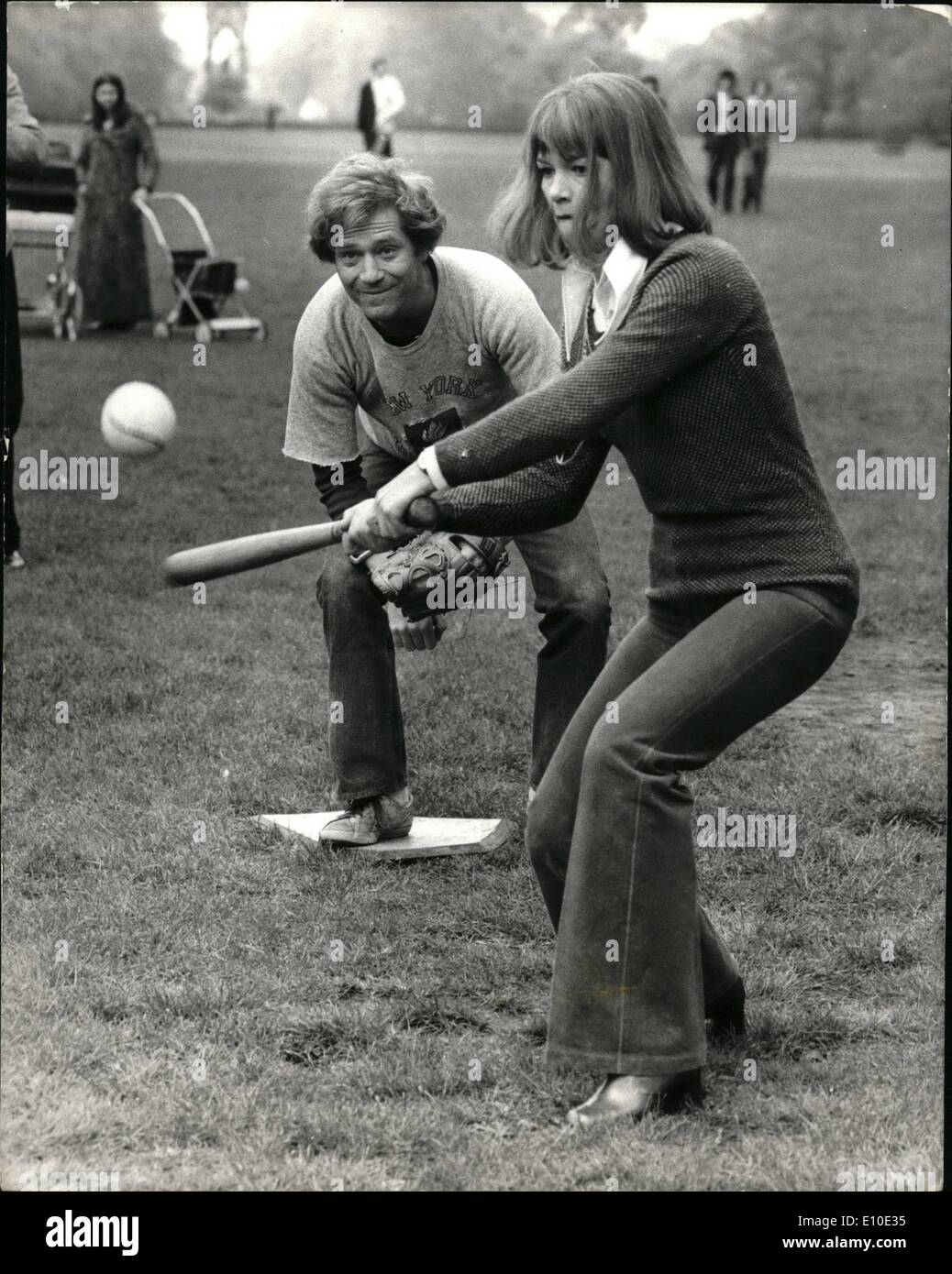 May 05, 1972 - Actress Glenda Jackson takes up American Baseball: Scenes were being shot in Hyde Park today filming sequences for the new Melvan Frank film ''A Tough of Class'' which started production this week. One of the film sequences being shot was a group of Americans playing a baseball game in which Glenda Jackson, (making her screen romantic comedy debut) and her co-star George Segal took part. Photo shows with George Segal behind Glenda Jackson makes a strike during the baseball game today. Stock Photo