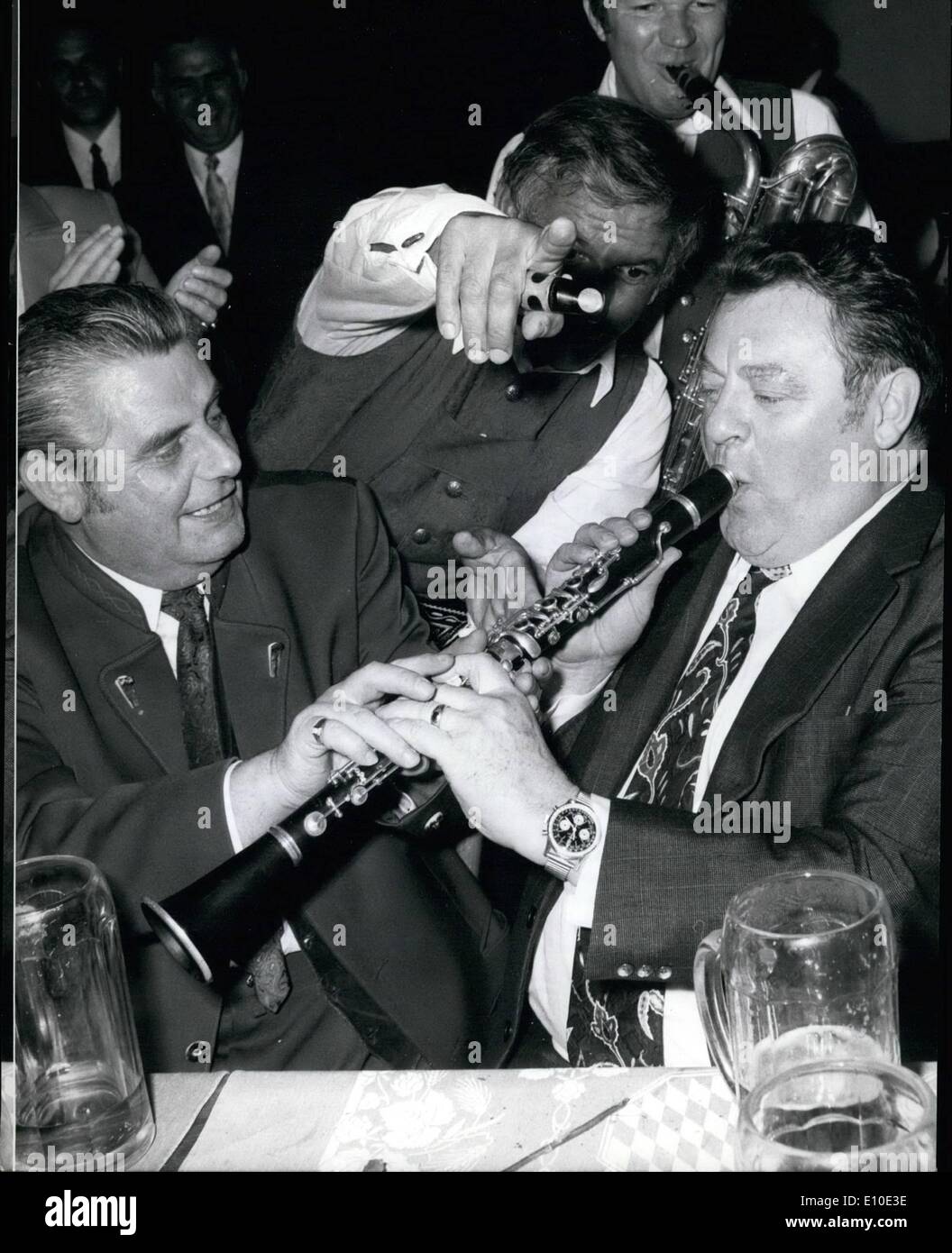 May 05, 1972 - Franz Josef Strauss: Chairman of the Christian Social Union in west Germany dropped in at the famous beer hall ''Hofbr&auml;uhaus'' in Munich Last night, where he was taught how to play the Clarinet. Critically watched by the band and his party friend George Loibl(left). he made a few tries and even managed to get some notes cut of the instrument. Stock Photo