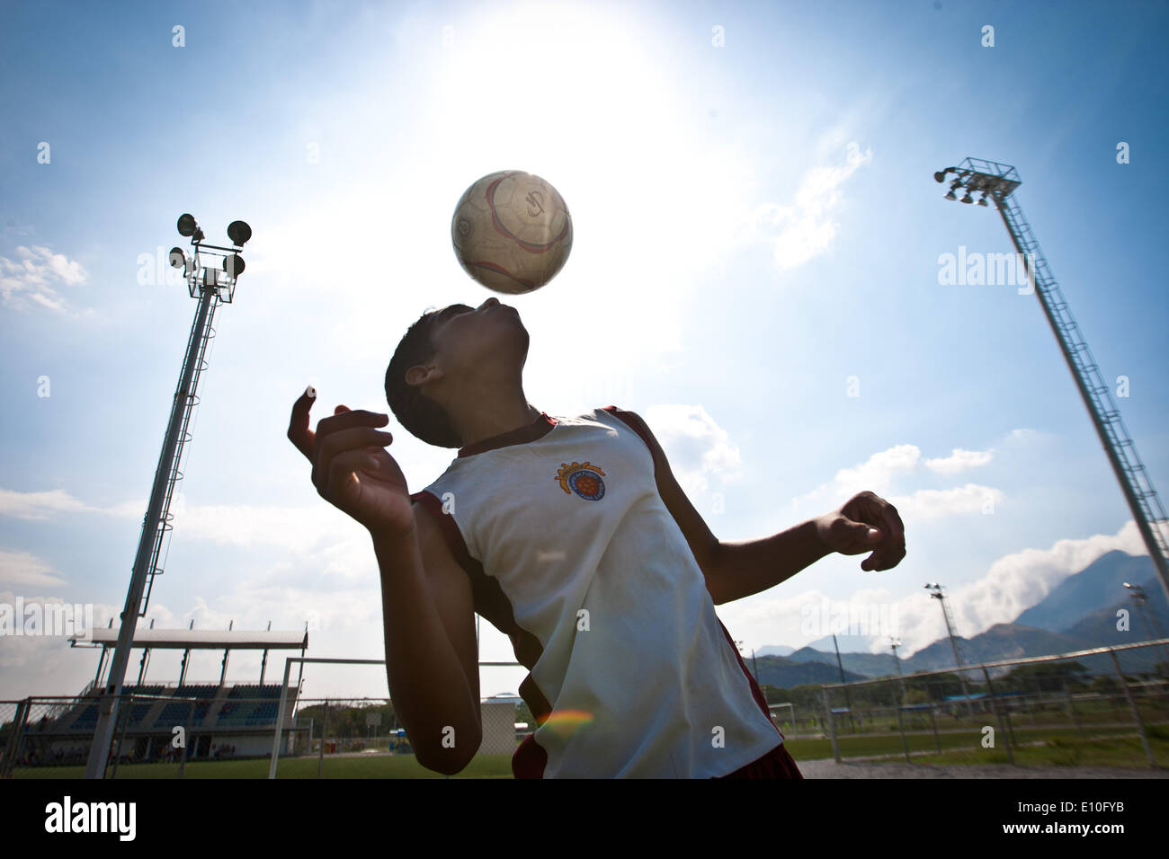 (140521) -- VALENCIA, May 21, 2014 (Xinhua) -- Image taken on May 17, 2014 shows a kid that belongs to one of the 11 seats of the Soccer School 'Juan Arango' Foundation taking part in a training in Valencia, Carabobo state, Venezuela. The Foundation seeks to catch, promote and encourage the practice of soccer among the youngest kids. (Xinhua/Carlos Ramirez) (da) (rt) Stock Photo