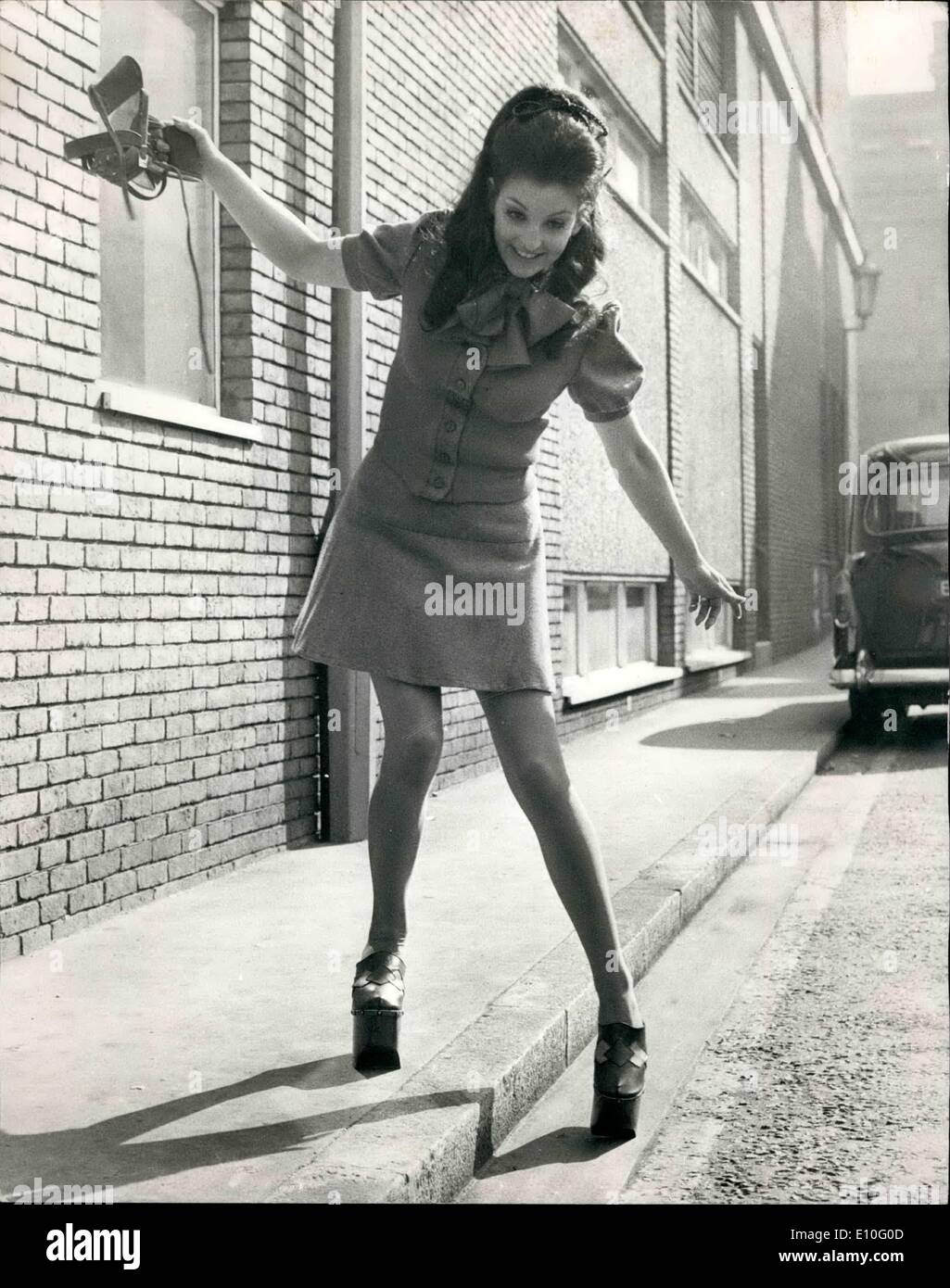 Oct. 10, 1972 - Walking Tall: London model Madeleine Bradley has that up-in-the-air feeling. And no wonder - for she's walking on 8'' high heels, though she has to carefully negotiate the kerb when wearing them. Says shoe importer Vernon Humpage, of Blackpool: ''It's a shoe designed with Women's Lib in mine - they allow even the smallest girl to look down on her man.'' They were being shown at the Spring Shoe Exhibition, organised by the British Footwear Manufacturers Federation, being held in London. Stock Photo