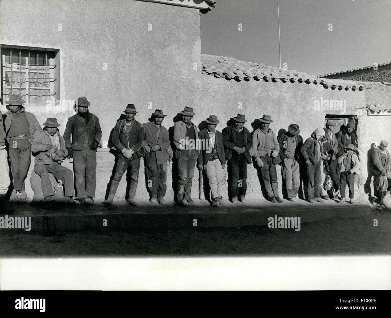 Nov. 11, 1972 - Workers Wait For their shift in Potosi, Bolivia: Potosi, Bolivia: Waiting for their morning shift in the tin mine workers bask in the morning sun.Potosi was famous for its silver and tin mines exploited by the Spaniards since the XVI century - Potosi's silver mines are today exhausted, but the tin mines are still important and contribute to the land's economy.Potosi, a town of about60'000 inhabitants, lies at an altitude of over 4000 meters. Stock Photo