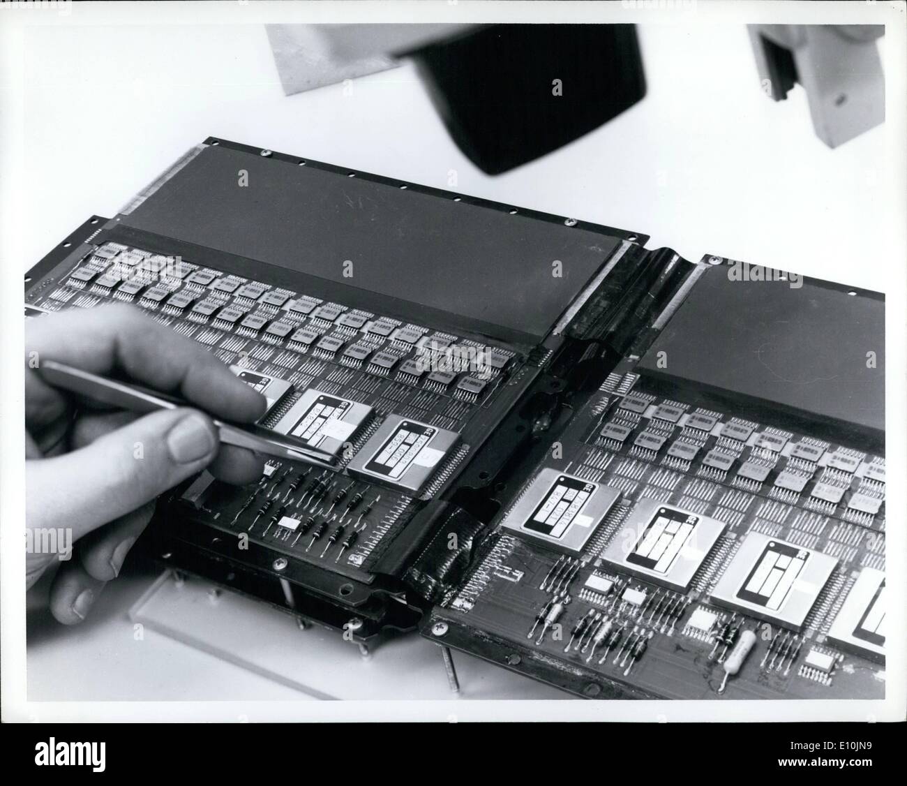 Apr. 04, 1973 - Closeup of one of the new 4,000-word by 25-bit plated tungsten wire memory arrays during assembly at the Aerospace Electronic Systems Department of General Electric's Aircraft Equipment Division, Utica, N.Y. Based on wire electropating process developed at the GE Research and Development Center, Schenectady, N.Y. the new memory array is four times smaller and lighter than conventional plated wire memories and required only half the drive energy Stock Photo