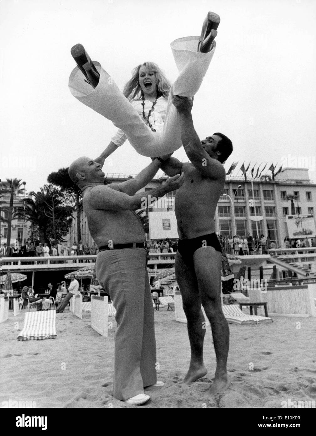 comedian actress AVI ANDRESS is tossed in air by famous wrestlers, CHERI BIBI and JAKY LLIARD during the Cannes Film Festival Stock Photo