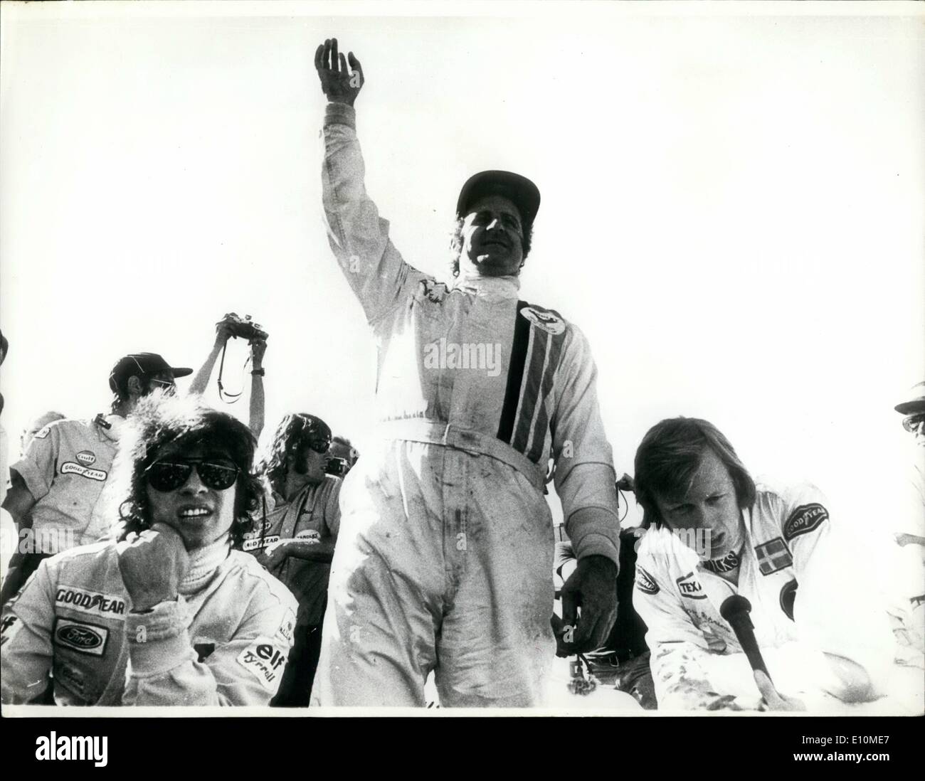 Jun. 06, 1973 - Denny Hume of New Zealand Wins the Swedish Grand Prix. Denny Hume the New Zealand racing Driver driving a McLaren won the Swedish Grand Prix in Anderstorp Sweden on Sunday. OPS: After the race Denny Hume seen raising his hand after winning the Swedish Grand Prix, left is Francois Cevert, who was third , and right, Ronnie Peterson second. Stock Photo