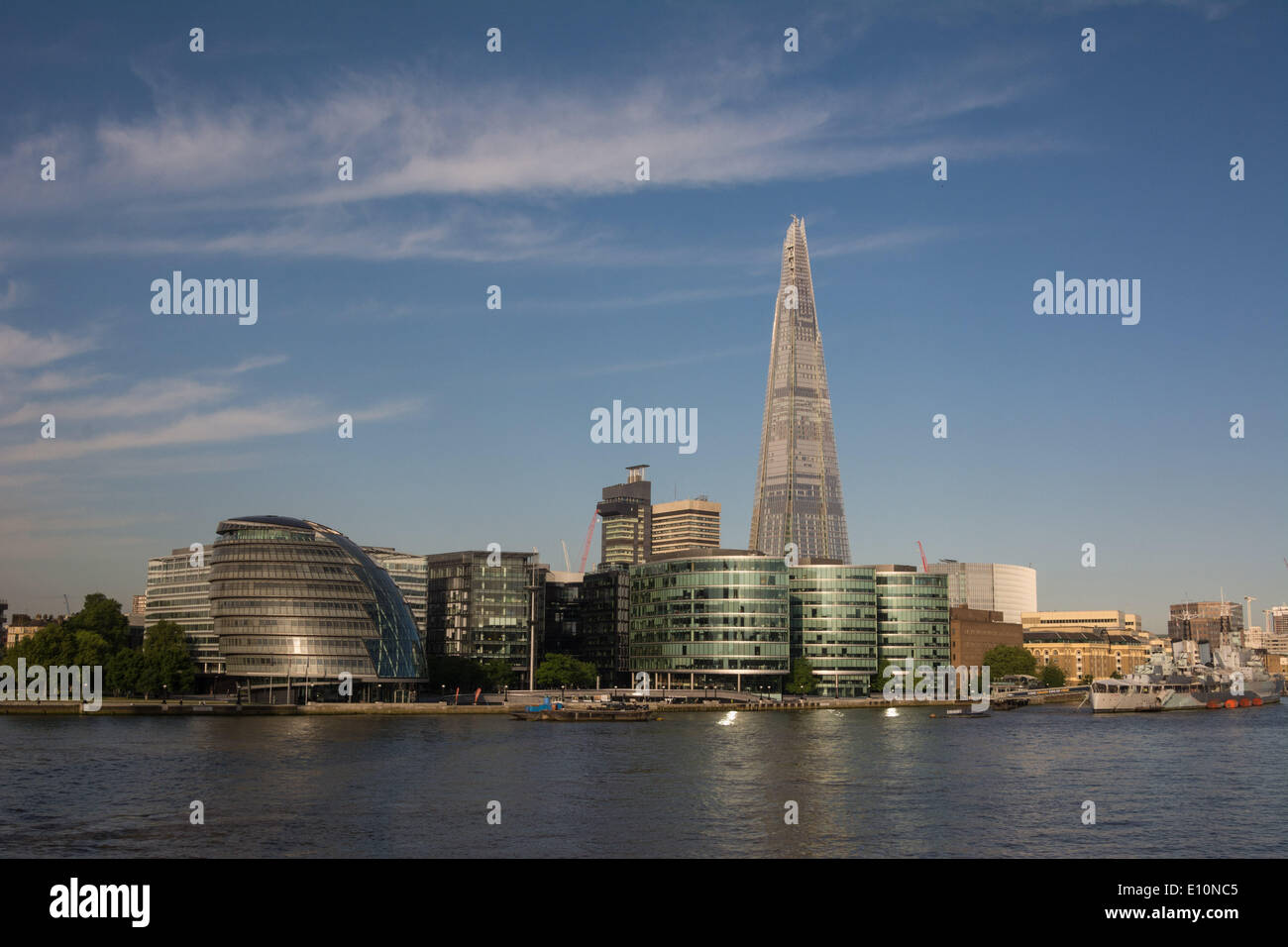 London, UK. 21st May 2014. Iconic London landmarks The Shard Skyscraper and City Hall gleam on the south bank of the river Thames as London wakes to a beautiful summers morning. Credit:  Patricia Phillips/Alamy Live News Stock Photo