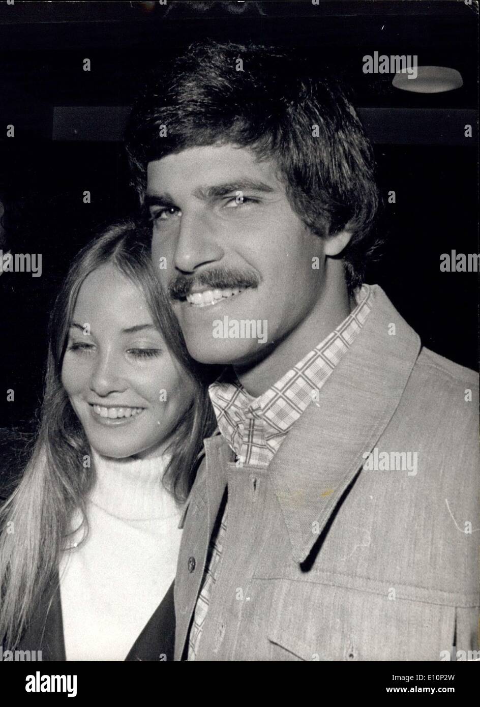 Nov. 09, 1973 - Mark Spitz visits London with his wife: Golden boy Mark Spitz, who won seven Olympic Gold Medals at Munich, wants to try again, as a yachtsman. But Mark, aged 23, who was accompanied by his wife Susan on a visit to London yesterday, is barred because of his TV earnings since the Games. Photo shows Mark Spitz, the American swimming ace, pictured with his wife Susan when they arrived in London yesterday. Stock Photo