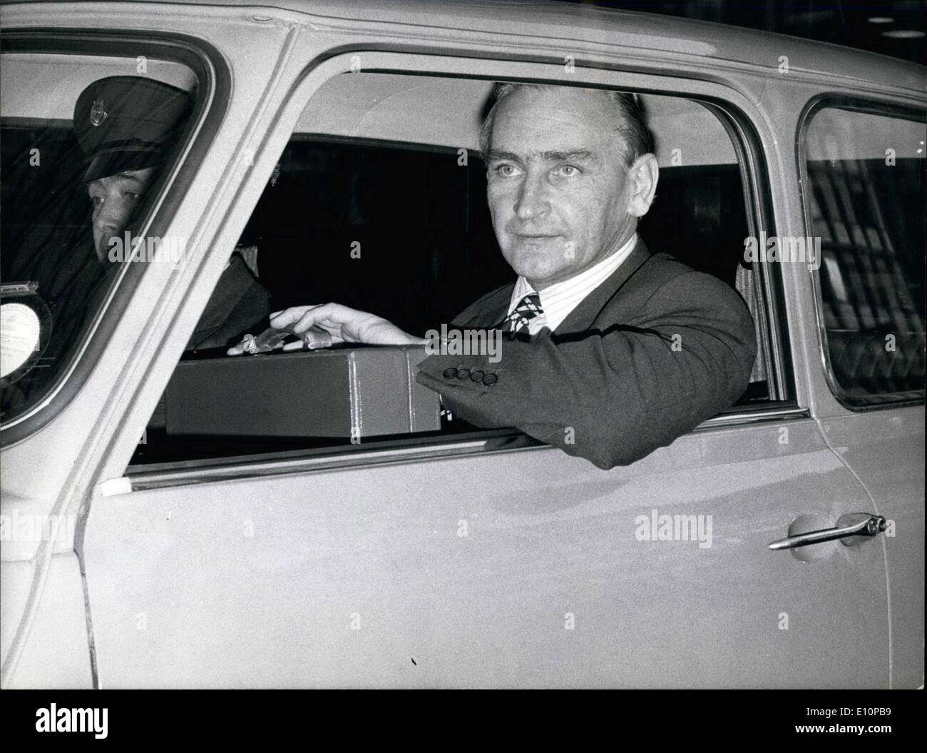 Nov. 11, 1973 - Setting An Example: Mr. Boardman, Minister for Industry, who is in charge of contingency plans for petrol and oil rationing because of the Middle East war, setting an example in fuel conservancy as he gave up his 3.5 litre Rover for a Mini at the Department of Trade and Industry yesterday. Stock Photo