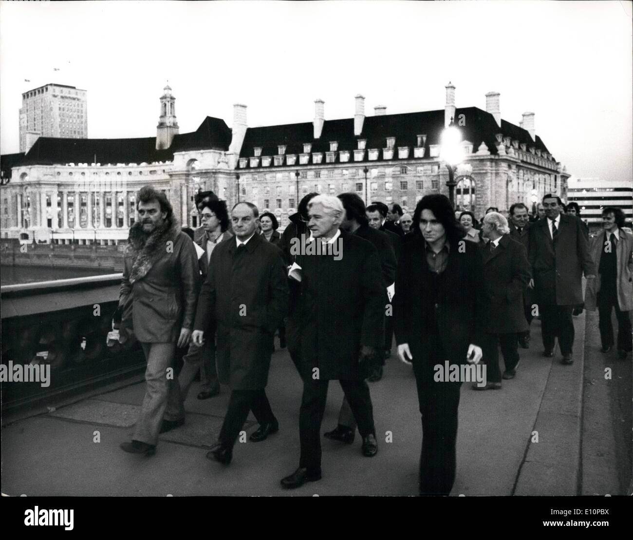 Nov. 11, 1973 - GLC Leader stages a Mass Lobby of M.P.s Following the Crisis Hitting London's Public Services: GLC Labour London Leader Sir Reg Goodwin halted the Greater London Council's meeting today and led his followers across Westminster Bridge to the House of Commons for a mass Lobby of M.P.s. His action was sparked off by the crisis hitting London's public Services. Picture shows: Against the background of the GLC headquarters at county Hall, Sir Reg Goodwin (second from left ) leads his followers across Westminster Bridge on their way to the house of Commons this evening. Stock Photo