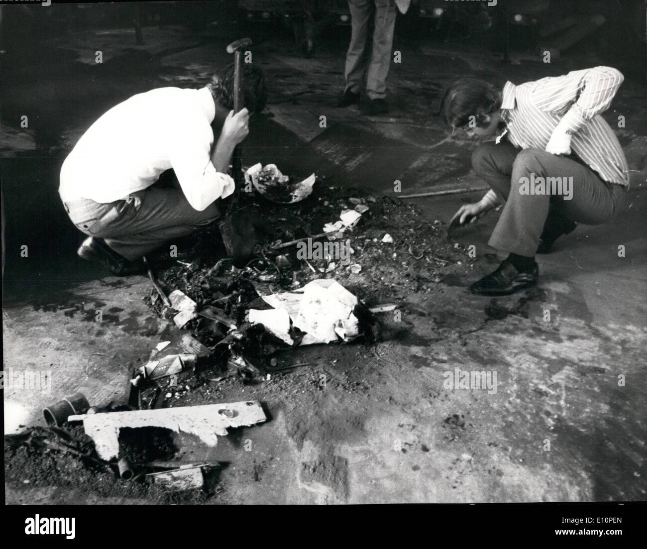 Sep. 09, 1973 - Bomb Explosion at Barracks in Chelsea. Five people were injured and several Army vehicles damaged when a bomb exploded in a garage at the Duke of York barracks in Kings Road, Chelsea, this morning. Keystone Photo Shows: Scotland Yard detectives sifting bomb debris, in the garage of the barracks today. Stock Photo