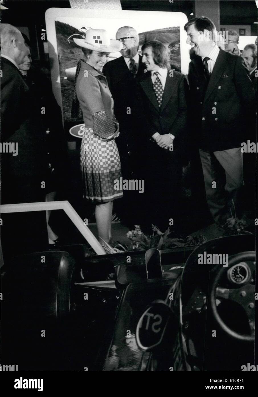 Oct. 10, 1973 - Princess Anne opens the Motor Show.: Princess Anne today opened the London International Motor Show at Earls Court. Photo shows Princess Anne shares a joke with Jackie Stewart, who recently announced his retirement from motor racing, in front of his Ford Tyrrell racing car - at the Show today. Stock Photo