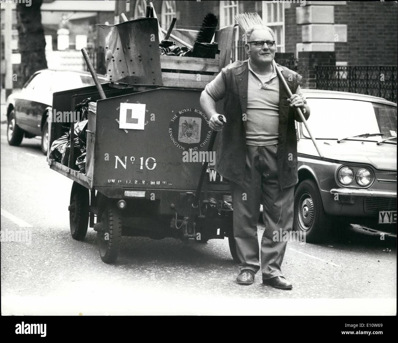 Apr. 04, 1974 - ''L'' Plates for Dust Cart Driver: Road Sweeper Bernie Heim pictures with his Dust Cart in London this morning displaying his 'L Plates' Bernie has net yet passed his test to drive the cart without a full Licence and and his depet they have net the time to take him for a test, so he carries on keeping London(sreads clean as a Learner driver. Stock Photo