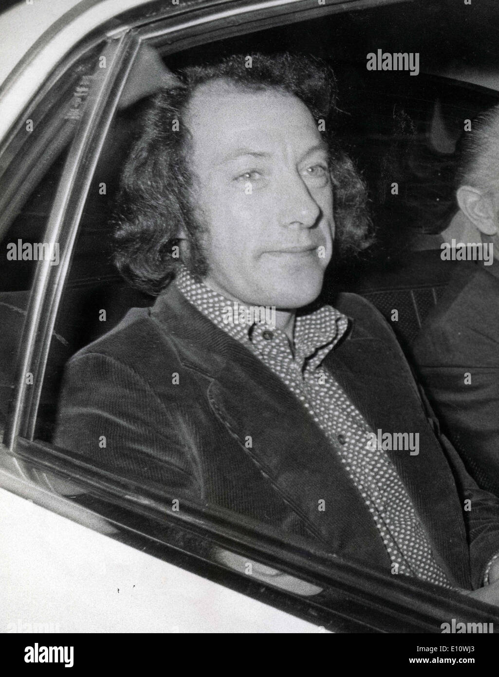 Apr 23, 1974 - London, England, United Kingdom - RONALD MILHENCH on his way to the Wolverhampton Magistrates Court in a police car from the Winson Green prison to stand trial for trying to obtain 25,000 pounds by means of a criminal deception from the Associated Newspapers. Stock Photo