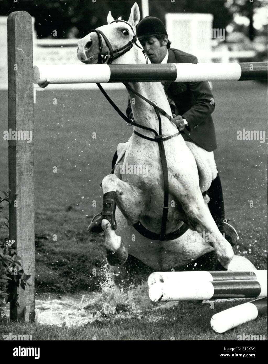 Jul. 07, 1974 - Men 's World Horse Jumping Championship at Hickstead Schockmohle of West Germany Falls: The first round of the Men' s World Horse Jumping Championships started today at Hickstead ,Sussex. Photo shows Alwin Schockemohle of West Germany comes off when his horse Rex The Rodeer refused to take the water Ditch. Stock Photo