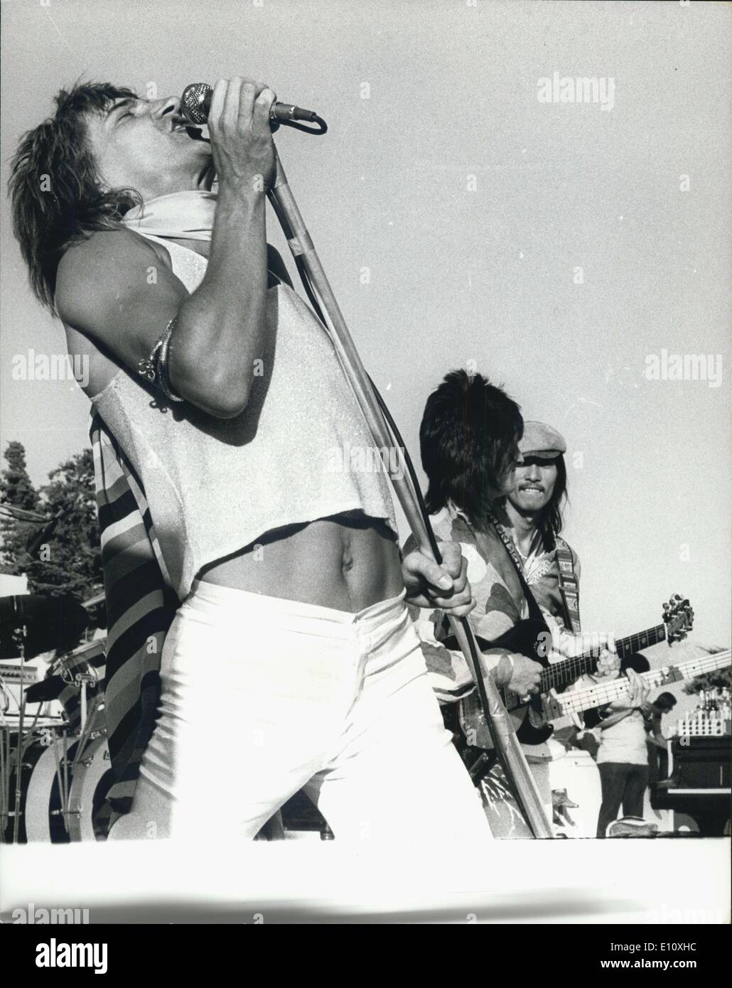 May 23, 1974 - Totsu Yamauchi, the Japanese guitarist who replaced Ronnie Lane stands in the line up with Rod Stewart and Ronnie Wood during a concert. Stock Photo