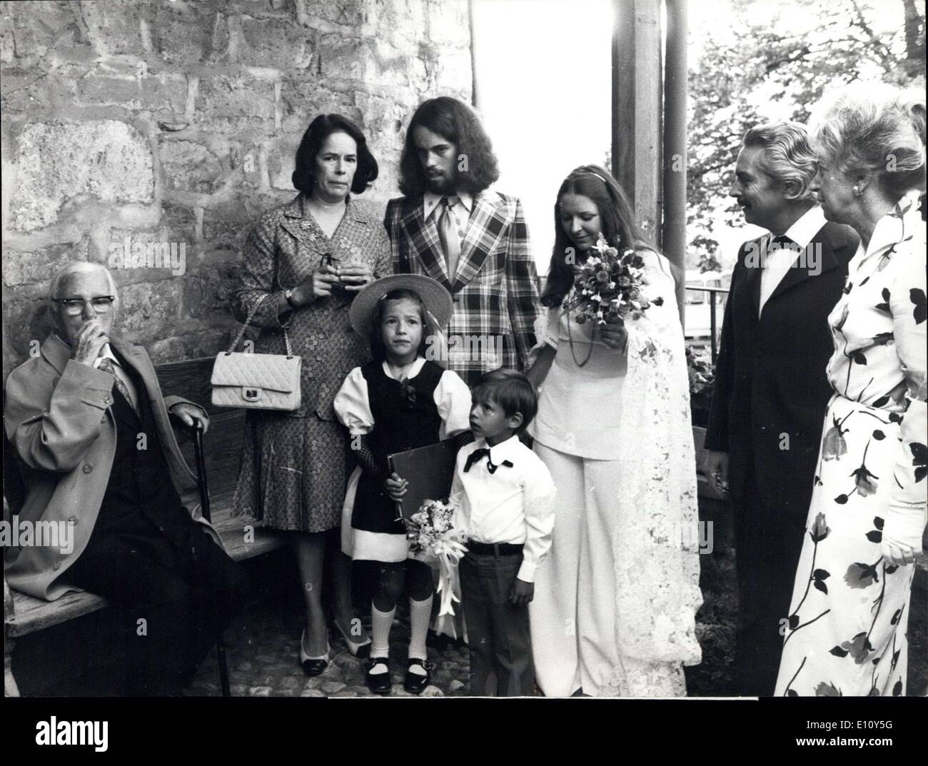 Aug. 11, 1974 - Marriage of Young Chaplin: At Vevey, Switzerland, a new girl entered in Chaplin - family. Saturday School-teacher Sandra Guignard married Charlie's 21 year old son Eugene. Picture shows Charlie Chaplin Sen. (left) with wife Oana, assisitng marriage ceremonies of son Eigene anddaughter-in law Sandra(right) Stock Photo