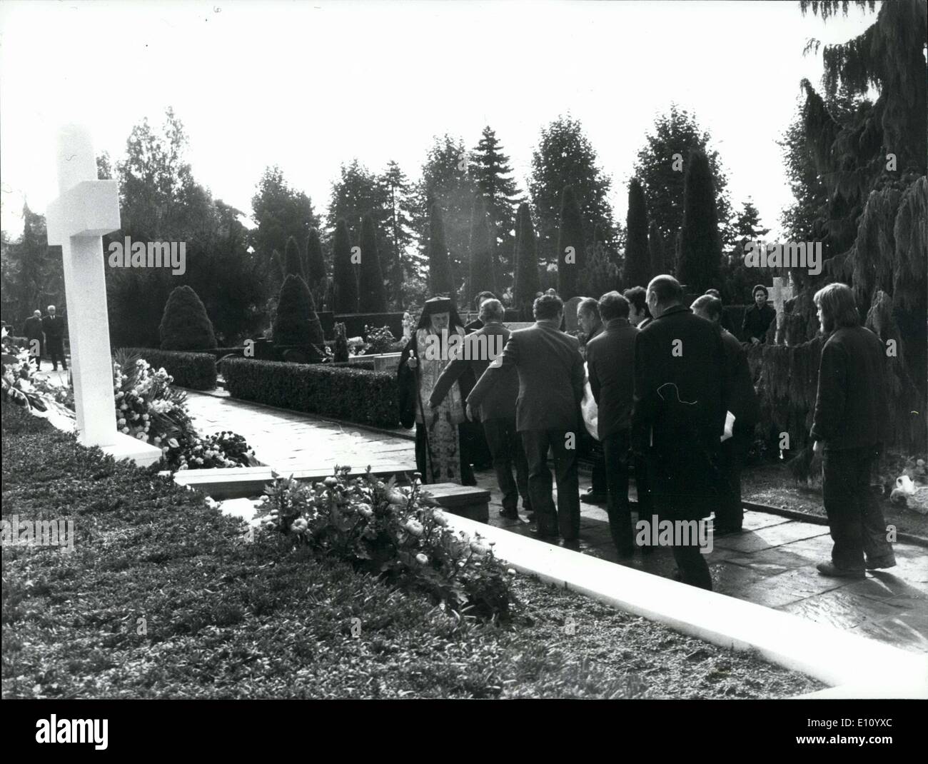 Oct. 17, 1974 - The Funerals of Tina Niarchos: The funerals of Tina Niarchos who died last week in Paris took place at the cimitery ''Bois de vaux'' in Lausanne, Switzerland, with the presence of the whole Niarchos and part of the Onassis family. Photo shows the metropolite of Paris and the mourning family at the family grave of the Niarchos. Stock Photo