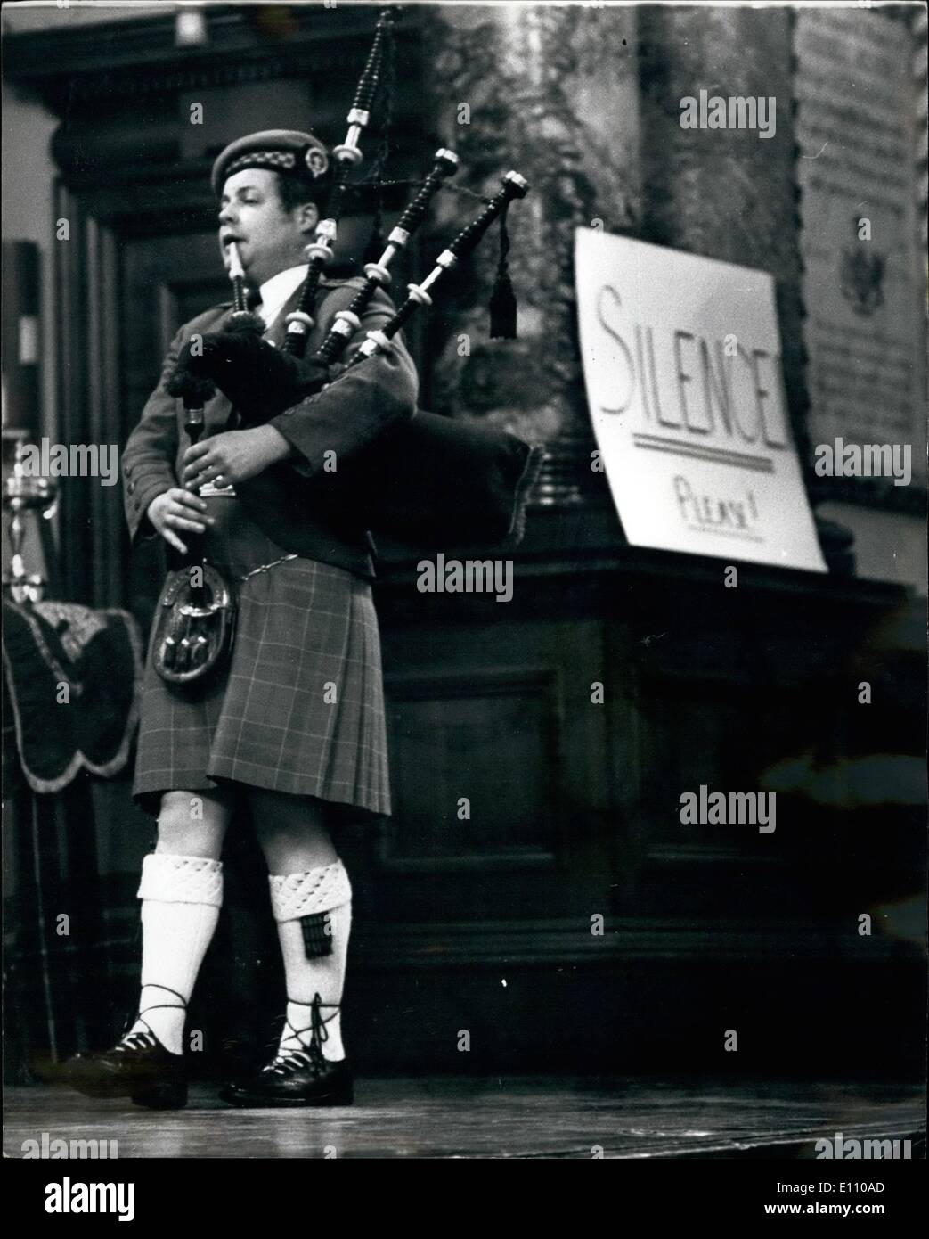 Nov. 11, 1974 - Annual competition of Scottish Piping society. the annual competitions of the Scittish Piping society of London, were being held today at Chelsea town hall. Photo shows:- K. MacDonald, of Glasgow, competeing in the Bratach Gorm (known as the Doctor Calum MacCrimmon Bratach Gorm challenge trophy), one of the most coveted awards in piping. Obviously The 'silence please' notice didn't apply to him. Stock Photo