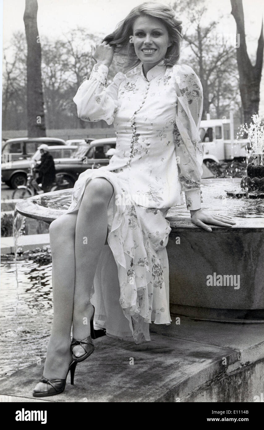 Mar. 8, 1975 - London, ENgland, U.K. - Actress JOANNA LUMLEY the super-girl of the television show, 'Avengers' sitting on a fountaint at a press conference. Stock Photo