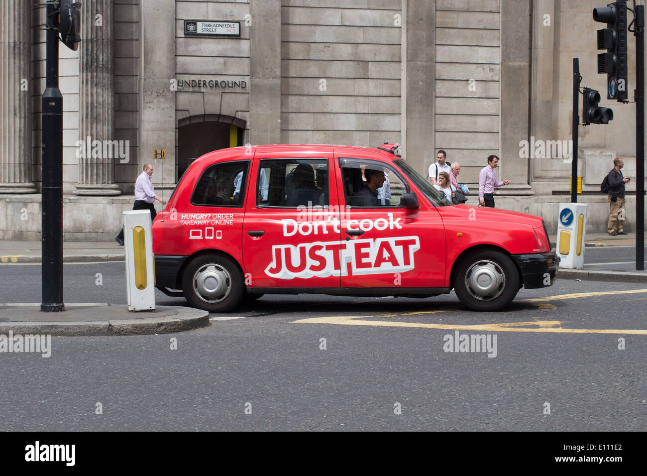 London taxi cab on Threadneedle Street London, sponsored by Just Eat ...