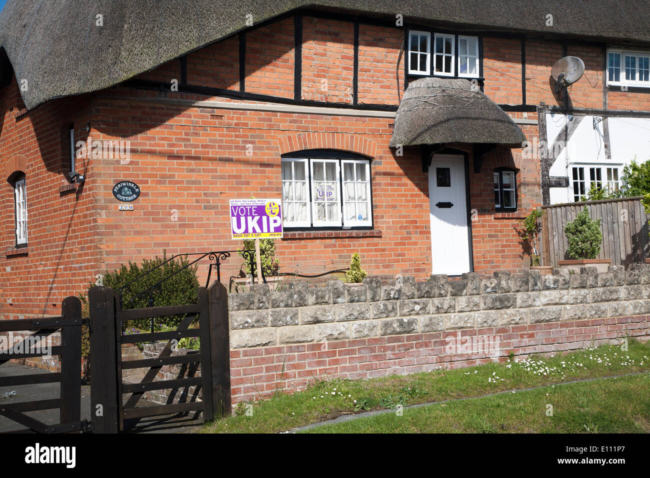 Burbage, Wiltshire, England 21 May 2014,  Vote UKIP poster displayed in garden of thatched country cottage, a day before European elections Credit:  geographyphotos/17�Թ����� Live News Stock Photo