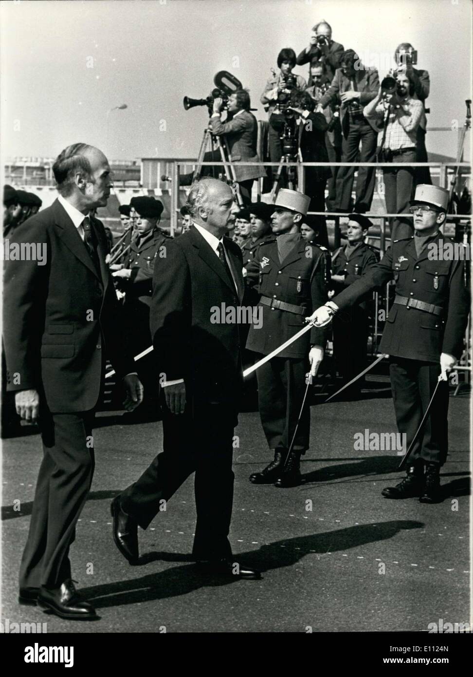Apr. 21, 1975 - Mr. Walter Scheel, President of Germany, and his wife arrived in Paris this afternoon for a 5-day official visit in France. Picture: President Giscard d'Estaing (left) and Mr. Walter Scheel passing in front of the honor guard at Orly airport. Stock Photo