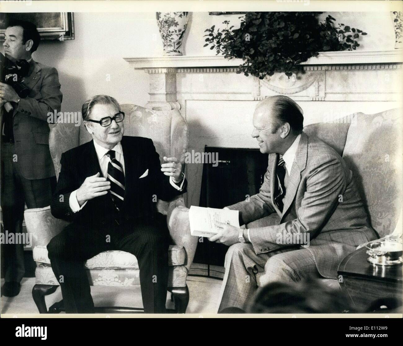 Jun. 06, 1975 - The white house, Washington DC: Vice President Nelson A. Rockefeller presenting his CIA Commission report to the President in the Oval Office. is holding the commission report. Credit Brian Alpert. Stock Photo