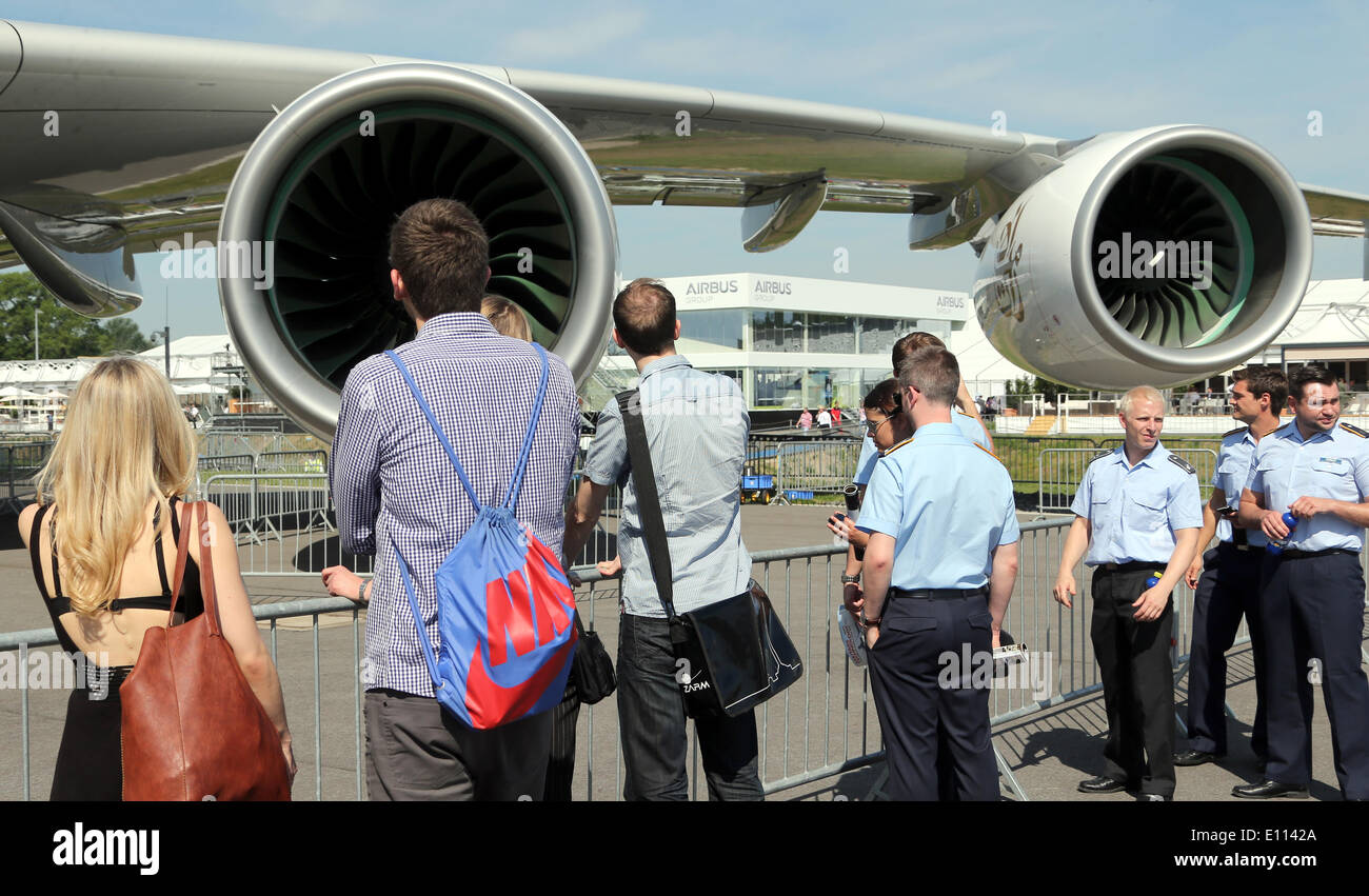 Visitors look at an Airbus A380 engine at the ILA Berlin Air Show 2014 in Selchow, Germany, 21 May 2014. The aerospace and defence industry exhibition takes place at the southern area of Berlin-Schoenefeld airport from 20 till 25 May 2014. Photo: WOLFGANG KUMM/DPA Stock Photo