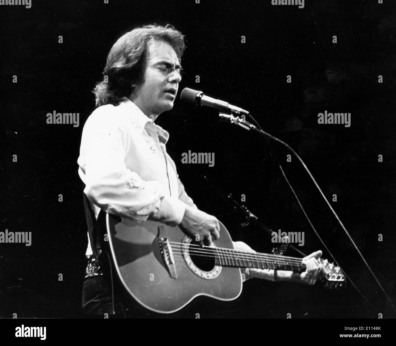Aug 05, 1975 - London, England, United Kingdom - NEIL DIAMOND performs. Neil Leslie Diamond (born January 24, 1941) is an American singer-songwriter. Neil Diamond is one of pop music's most enduring and successful singer-songwriters. As a successful pop music performer, Diamond scored a number of hits worldwide in the 1960s, 1970s, and 1980s. c. late 1970s. Stock Photo