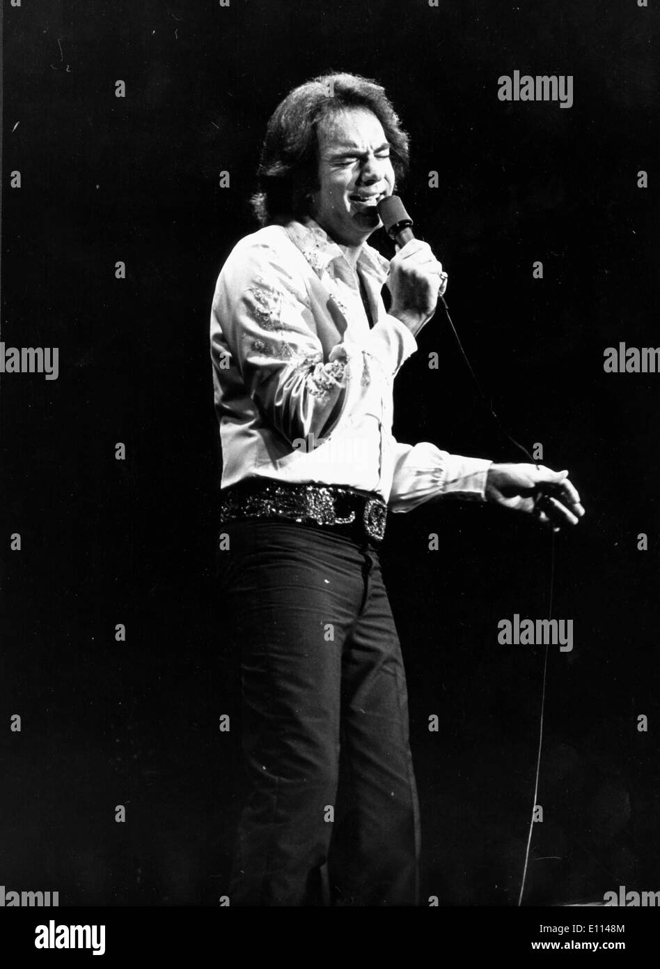 Aug 05, 1975 - London, England, United Kingdom - NEIL DIAMOND performs. Neil Leslie Diamond (born January 24, 1941) is an American singer-songwriter. Neil Diamond is one of pop music's most enduring and successful singer-songwriters. As a successful pop music performer, Diamond scored a number of hits worldwide in the 1960s, 1970s, and 1980s. c. late 1970s. Stock Photo