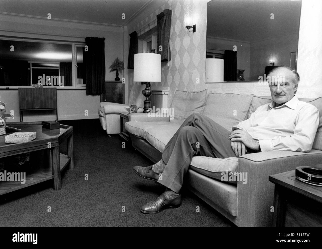 Aug 15, 1975; Essex, UK; The Governement yesterday ordered the inmediate dismissal of Mr. JOHN BARBER, 56, as deputy chairman and managing director of British Leyland Motor Corporation, which was nationalised on Monday. The picture shows John Barber taking it easy at his home in Upshire, Essex, last night after he had been dismissed as British Leyland's 42,000 a year deputy chairman and managing director. Stock Photo