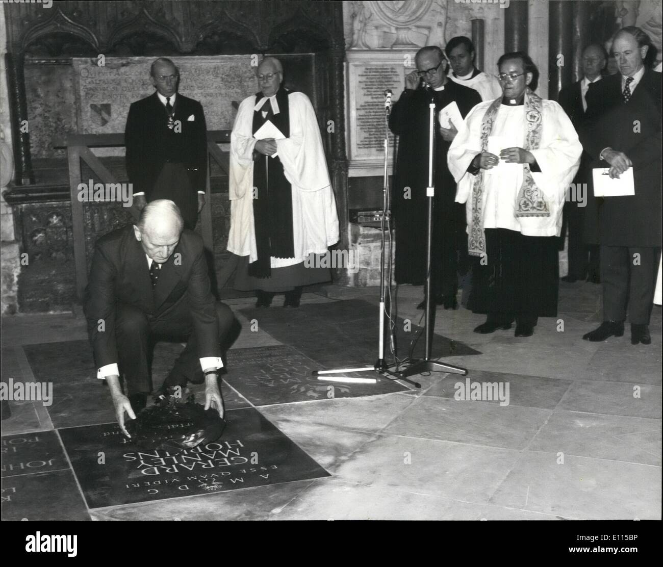 Dec. 12, 1975 - The Duke of Norfolk Unveils Memorial to Jesuit Poet in Westminster Abbey: The Duke of Norfolk, leading Roman Catholic Layman, today unveiled a memorial in Poet's Corner in Westminster Abbey to Gerard Manley Hopkins, the poet and Jesuit priest who died in 1889. This is the first time that a Roman Catholic poet has been memorialised in the Abbey since Dryden, Poet Laureate to Charles II and James II Photo shows: The Duke of Norfolk (extreme right) looks on as Mr. L Stock Photo