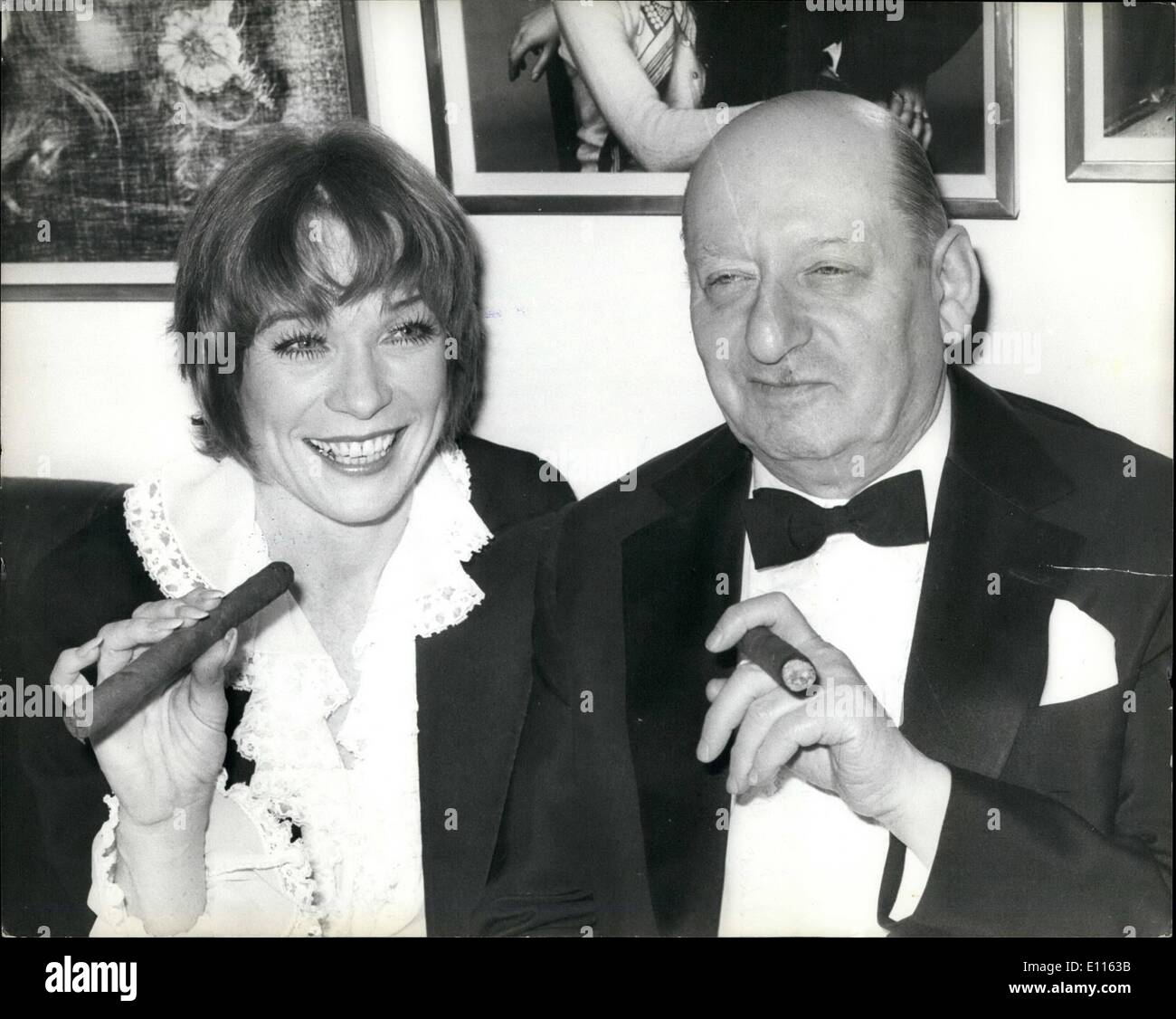 Feb. 02, 1976 - Exultant Triumph For Shirley MacLaine In Her London Stage Debut: Last night was a night of great triumph for the dazzling Shirley MacLaine after her smashhit stage debut at the London Palladium. The theatre stalls were packed with Celebrities who stood and cheered at the end of her show. Following her first night success Shirley went on to a party at Mr. Chow's in Kinghtsbridge. Picture Shows: Superstar Shirley MacLaine joins Sir Lew Grade in smoking a large cigar when she attended the Party after her successful London stage debut last night. Stock Photo