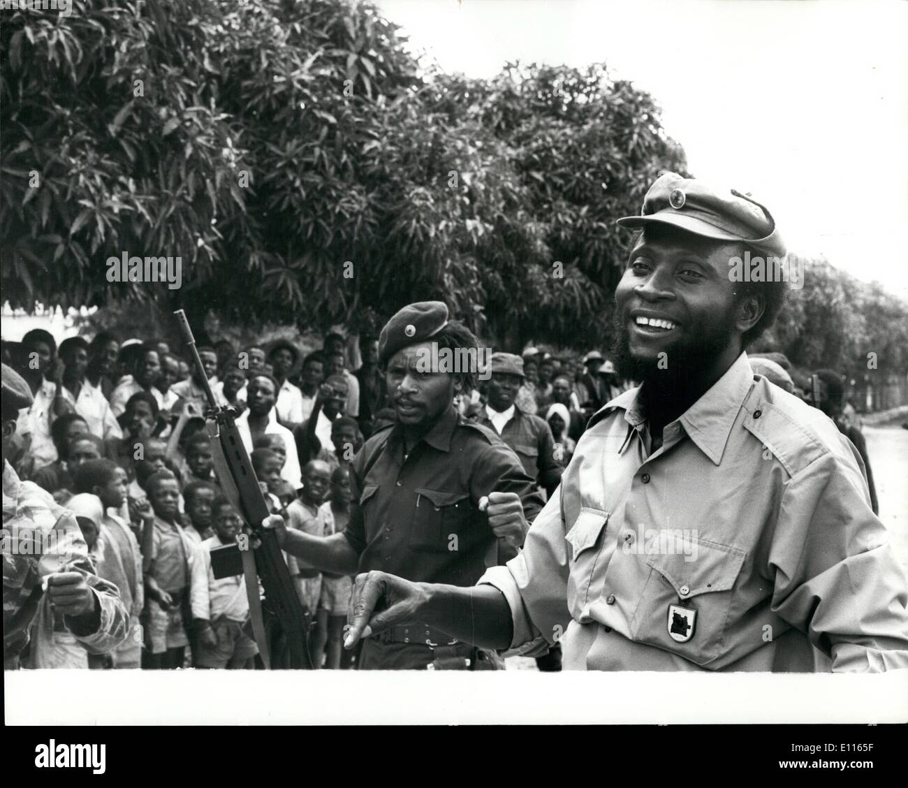 Jan. 01, 1976 - Unita's Defence Line Smashed: The Cuban-led M.P.L.A. Angelan forces claims the have smashed through Unita defences and opened the 100 mile read south to endanger Unita's political Capital Huambo.Photo shows Colonel Samuel Chiwale, Commander-in-chief of the Armed Forces of Unita seen enjoying a joke with some of his troops near the front line. Stock Photo