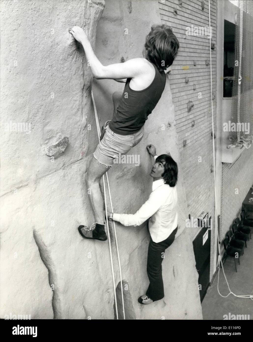 Mar. 03, 1976 - Everest Climber inaugurates new climbing wall at the Sobell Sports Centre: A new climbing wall was inaugurated at the Sobell Centre, Hornsey Road, London, .7 today by Everest climber, Peter Boardman. Introducing climbing walls into urban Sports cabtres is an attempt to inspire those who live in Central London with an interest they can pursue outside london. The climbing wall at the Sobell sports centre is 30 ft high.Photo shows Two of the young climbers seen near the top of the 30 ft wall followed by Everset climber Peter Boardman. Stock Photo
