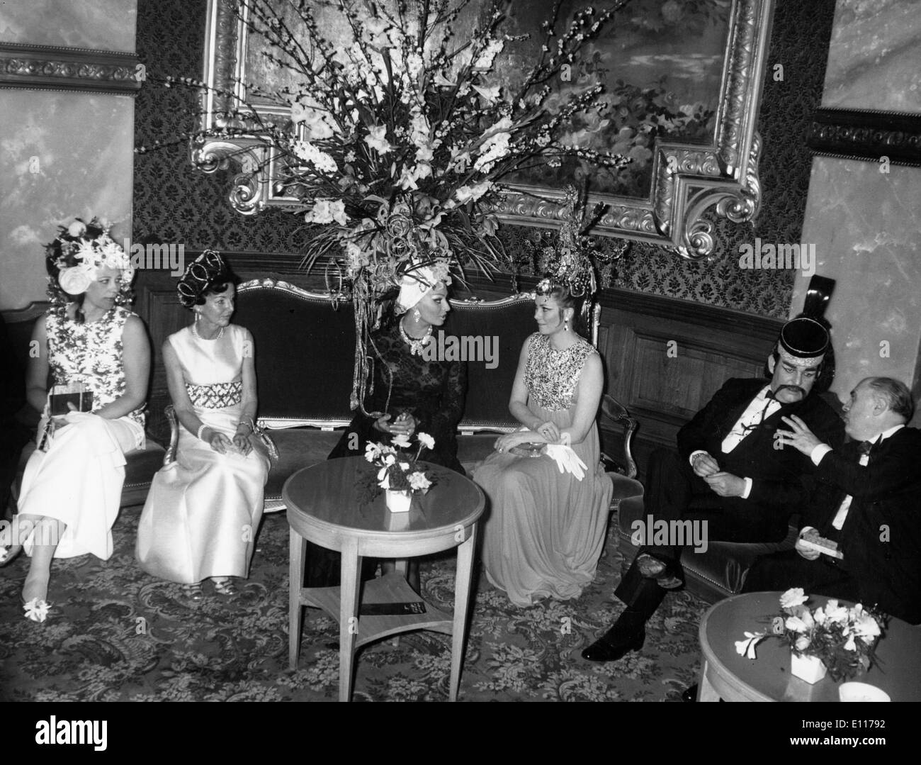 Actress Sophia Loren chats with Grace Kelly at ball Stock Photo