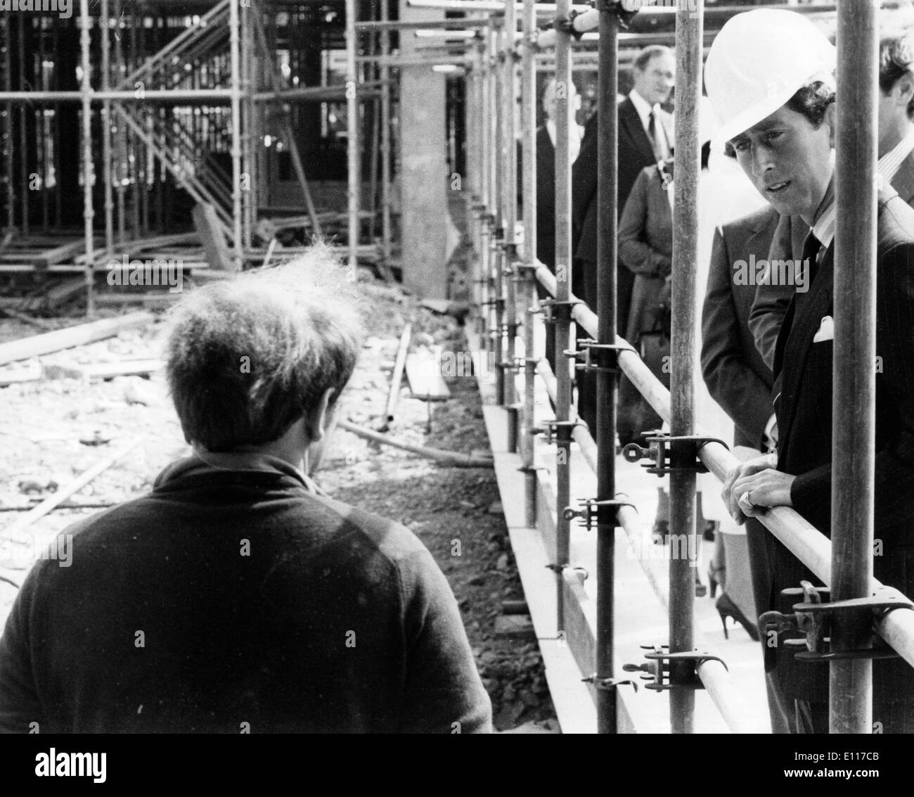 Prince Charles talks with worker on job site Stock Photo