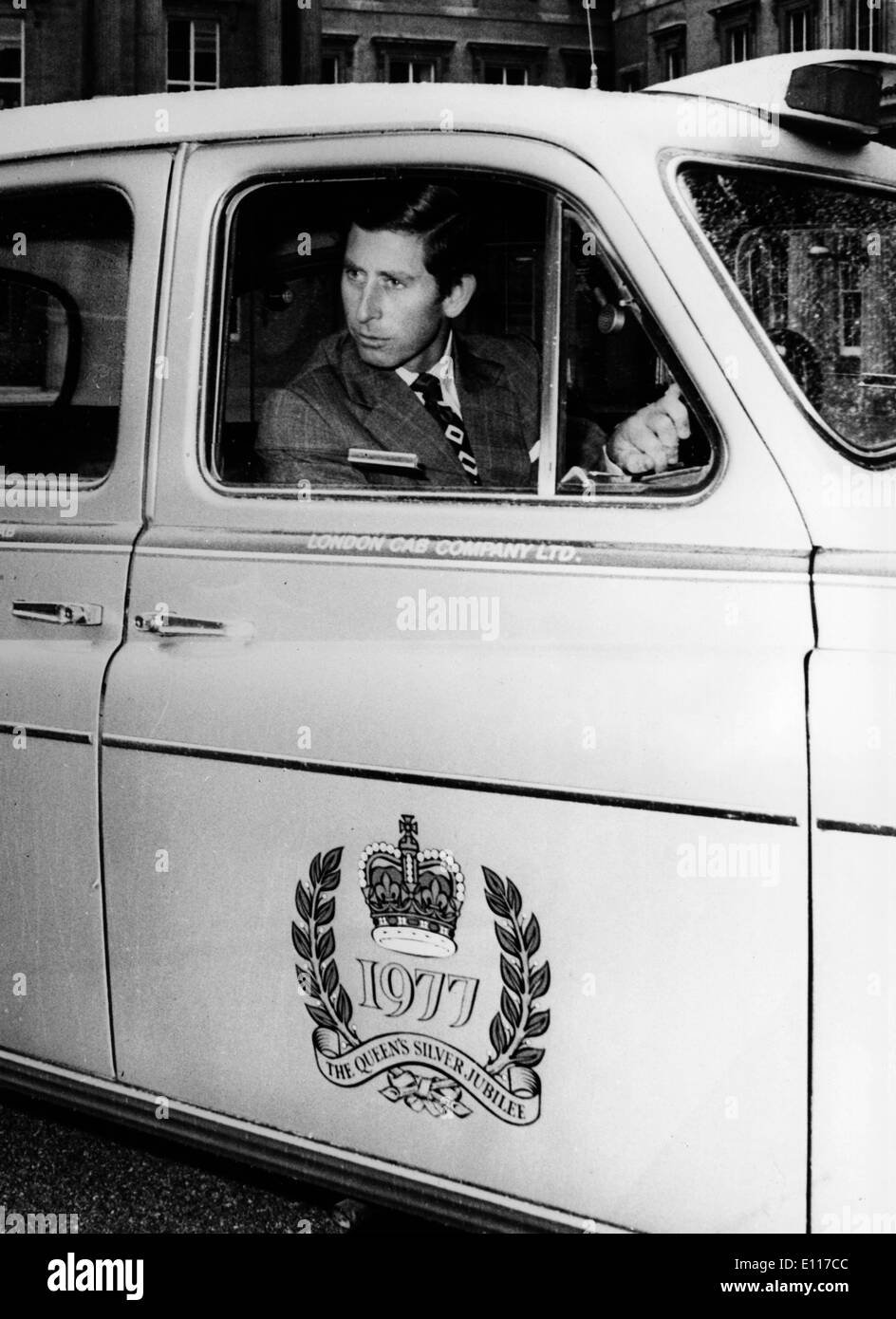 Prince Charles drives Silver Jubilee cab Stock Photo