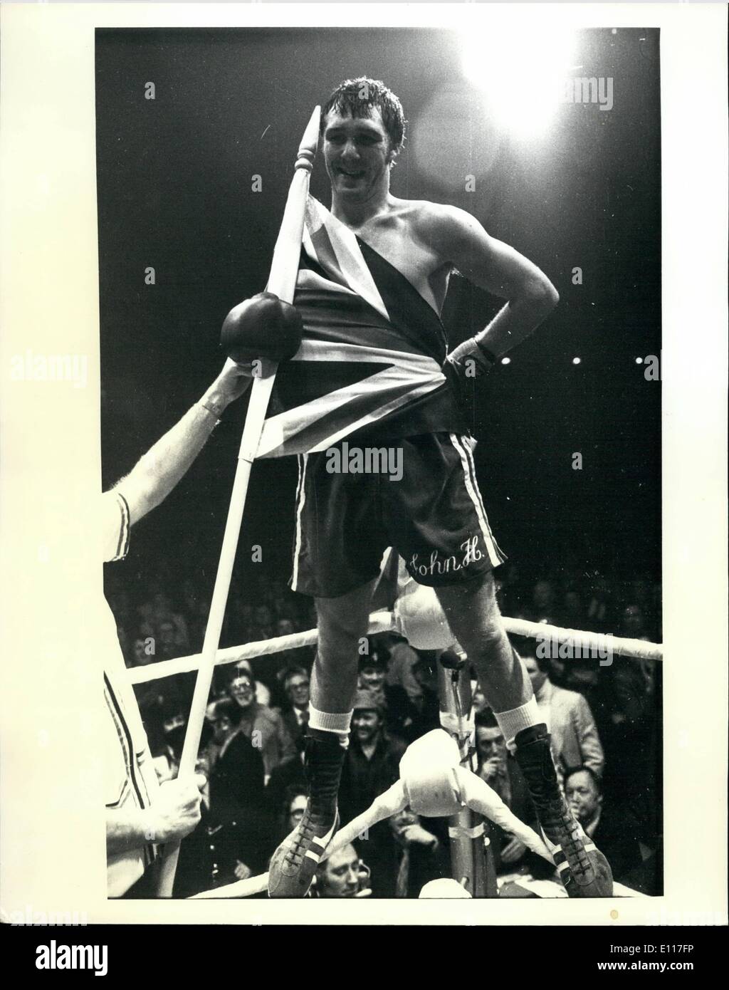 Mar. 03, 1976 - Stracey retains World Title: With a Union Jack wrapped around him, sunch British patriot John Stracey stands on the ropes of the boxing ring at the Empire Pool, Wembley, London on March 20, after hammering his challenger, Hdgmon Lewis of Detroit to defeat in ten rounds. Referee Harry Gibbs stopped the scheduled 15-round championship fight for the welterweight title in the 10th round when Lewis was being mercilessly pounded on the ropes. Stock Photo