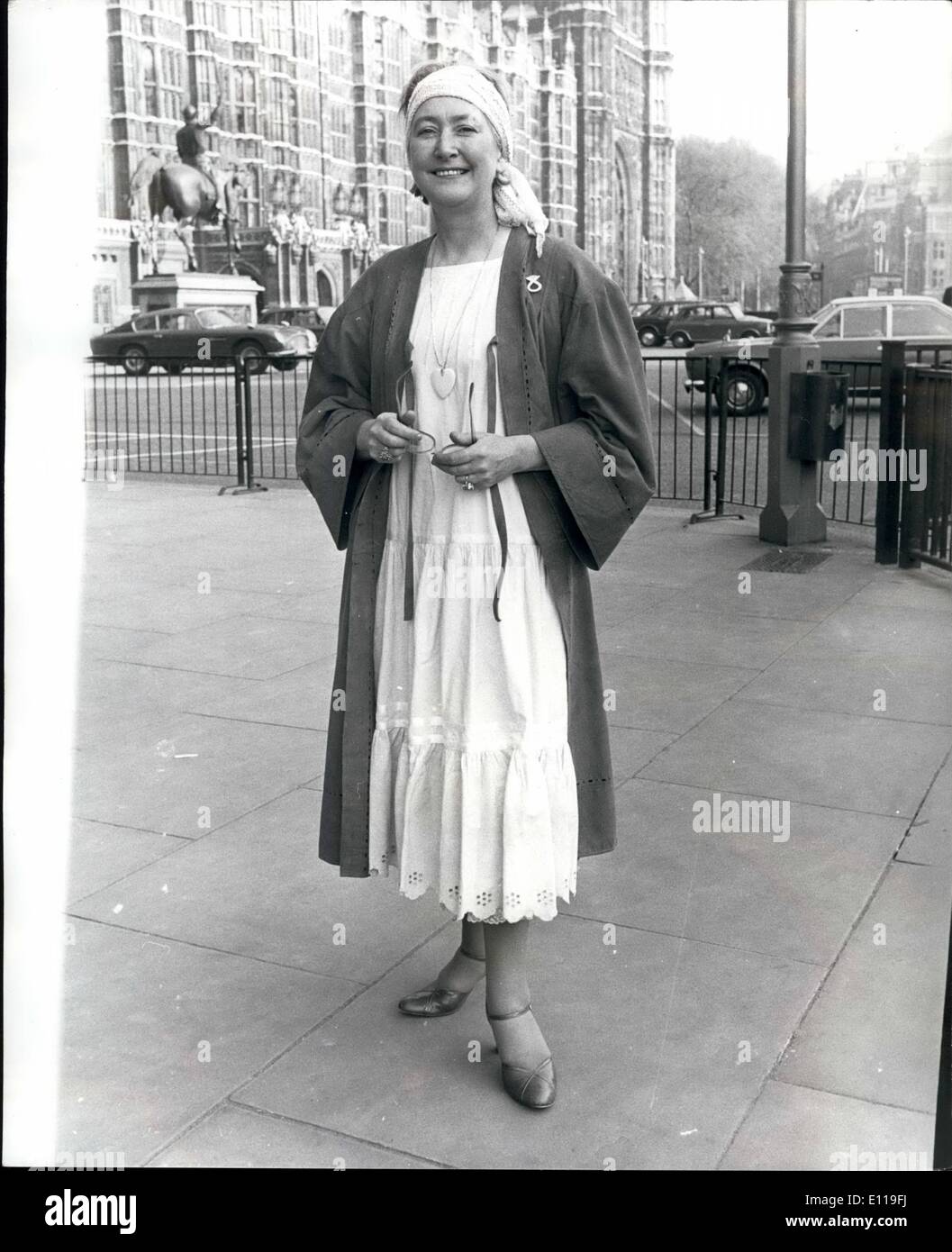 May 05, 1976 - Mrs. Winifred Ewing the Trendy MP. Mrs. Winifred Ewing, Scottish Nationalist MP for Moray and Nairn, sporting a cream cheescloth dress under a coat of orange goatskin, which caused something of a stir in the House of commons yesterday. The Speaker, Mr. Themas in his replay to Mr. Dalyell (Lab, West Lothian) is asked if it was normal to address the House in a dressing gown and nightie,''It is not, but the unexpected always happens ''. Mrs Ewing took it as a compliment and sad ''I've always liked rath flamboyant clothes and I dont see why the commons should change me'' Stock Photo