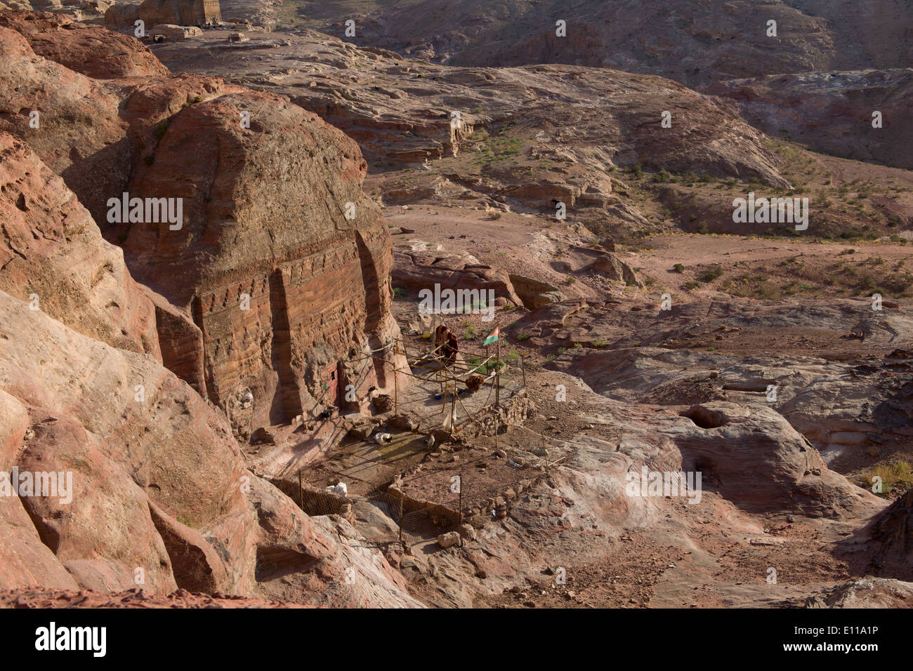 Small garden outside of an Inhabited tomb on the outskirsts of the site of Petra, Jordan Stock Photo