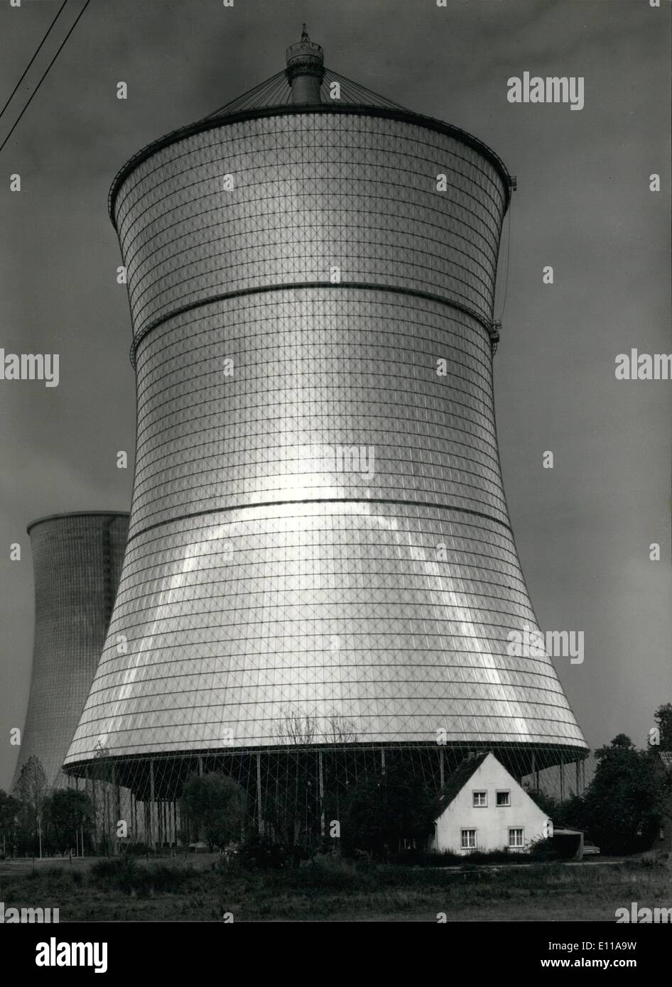 Oct. 10, 1976 - The gleaming parabola which the midday sun describes on the aluminium skin of the world's first steel net cooling tower can be seen as a symbol of excellent engineering achievement. The cooling tower structure, supplied and erected by Krupp and Ingenieurb&uuml;ro Leonhardt und Andr&auml; for the consortium Balcke-Durr/GEA, has now reached completion. The 181 m high tower, which can be seen from afar, is located at Schmehausen, 40 km east of Dortmund, on the site of the ''Westfalen'' power station where it will serve to dissipate the new 300-MW nuclear power plant Stock Photo