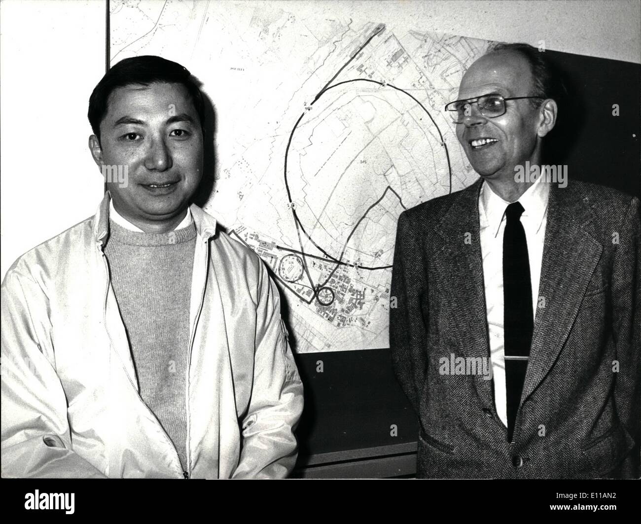 Oct. 10, 1976 - Physics-Nobel-Prize-winner Ting at Geneva: The winner of this year's physics-noble-prize, Mr. Samuel Ting, got the good news at Geneva, where he is working at the CERN-Center. Photo Shows Professor Ting (left) in front of a map, showing the CERN-Center at the Swiss-French-border near Geneva with Professor Van Hove, CERN-General-director (right) Stock Photo
