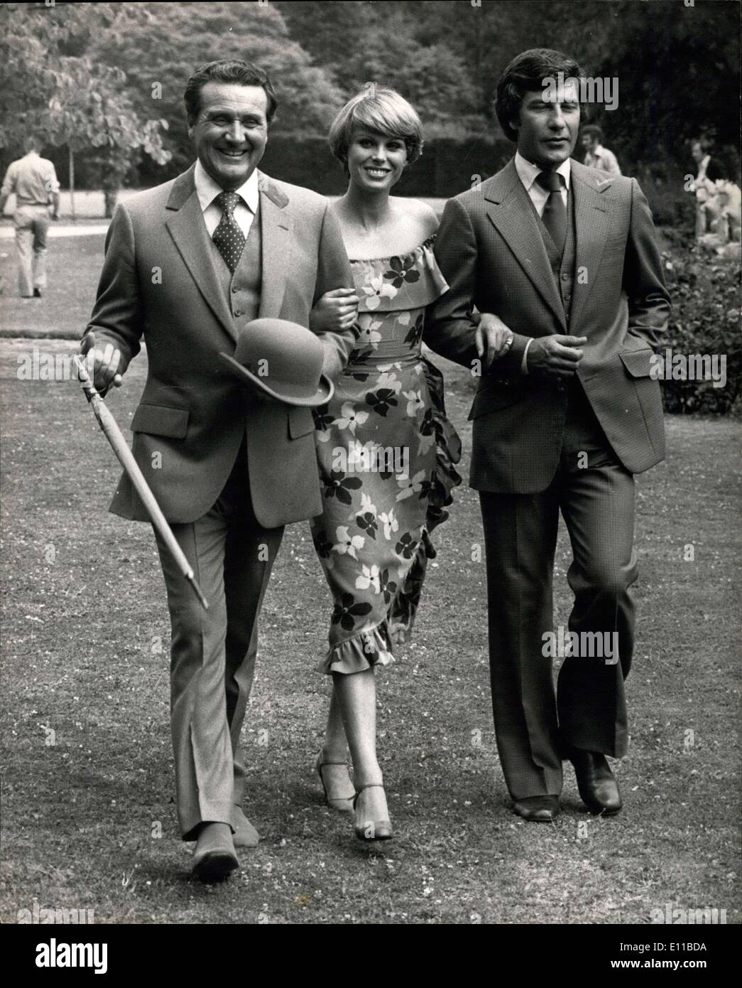 Jul. 12, 1976 - Stars of the New Adventure TV Series Get Together at Pinewood Studios. The principals of the new TV series ''The Avengers'' were pictured together for the first time at the Pinewood Studios today. They are Patric MacNee as John Steed, Joanna Lumley as Purdey, and Gareth Hunt as Mike Gambit. The old series of the Avengers grossed more than 7 million and about one third of this amount coming to Britain. OPS: The three Avengers (L to R), Patric MacNee, Joanna Lumley, and Gareth Hunt stride out during today photo call at Pinewood Studios. Stock Photo