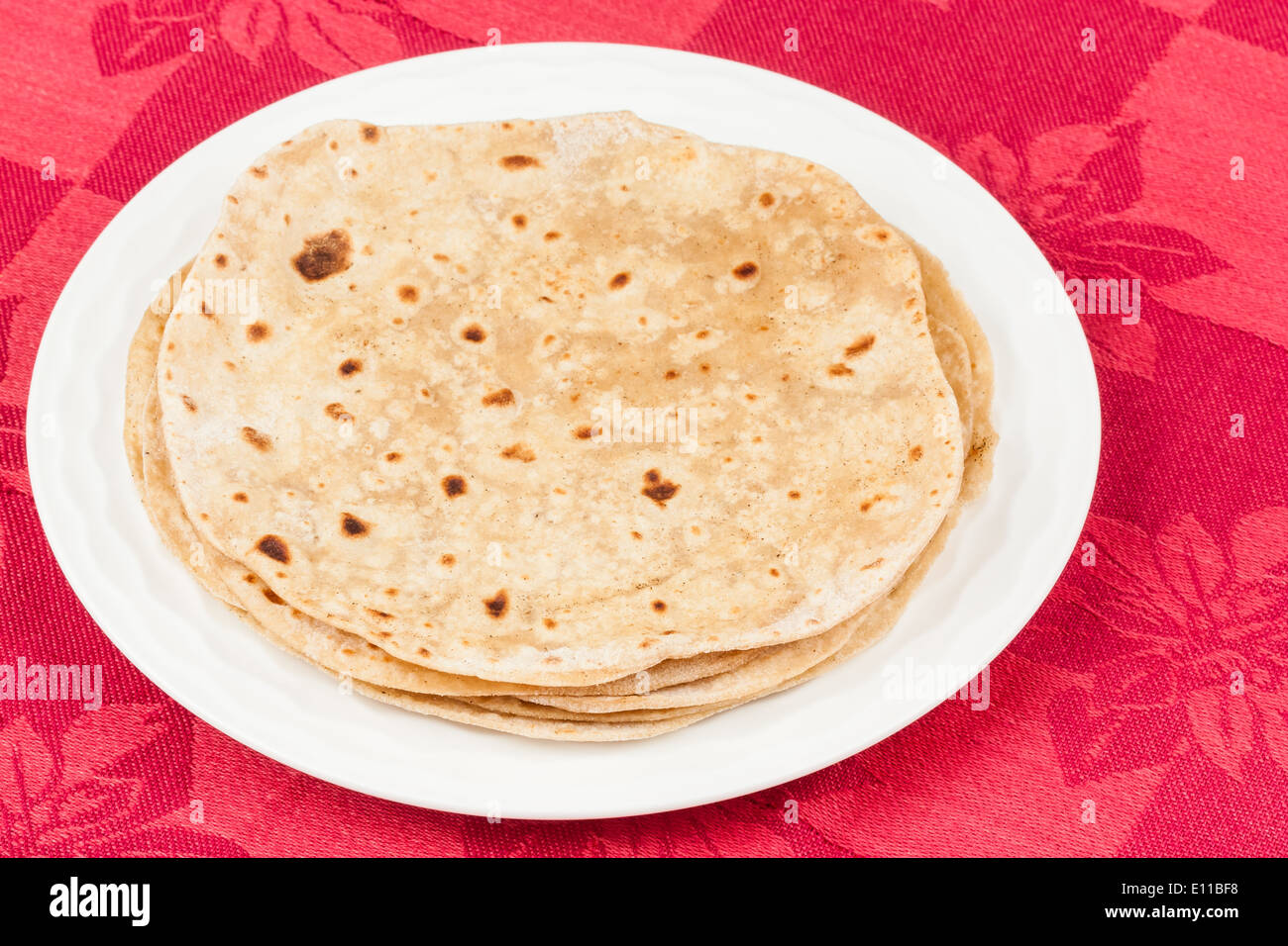 Homemade stack of chapati (indian bread) on a plate. Stock Photo