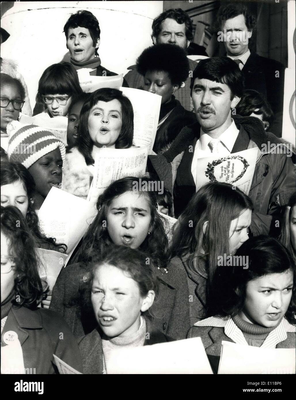 Dec. 09, 1976 - Actor John Alderton Helps To Launch Carol Marathon Actor John Alderton and his actress wife, Pauline Collins, today joined the ''War On Want'' staff and girls from the Mount Carmel School in Holloway, for the launch of War On Want's 1976 Carol Marathon. Each year a letter signed by Harry Secombe is sent to schools around the country asking children to go carol singing locally for the War on Want at Christmas. The Marathon was launched on the steps of St. Martin-in-th-Field, Trafalgar Square Stock Photo