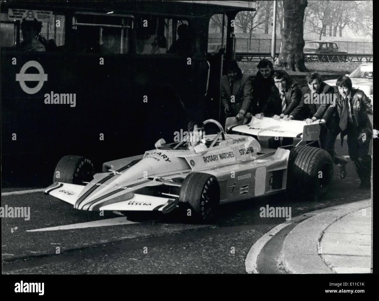 Dec. 12, 1976 - Introducing the new Stanley-BRM racing Car: BRM, once the great name in British motor-racing, will be back on the international scene next season. Louis Stanley, director of the new BRM team, unveiled their new car in London which has a completely redesigned V12 engine, producing almost 500 hp, a sleek new body and chasis. The No.1 driver will be Larry Perkins, a young Australian. Photo shows the new Stanley-BRM racing car being pushed into the Dorchester Hotel where it was on show to the press. Stock Photo