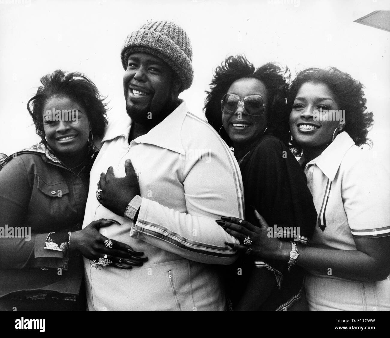 May 09, 1975; London, England, UK; Pop star singer BARRY WHITE (1944-2003) had many soul and disco hits, he is pictured with the ladies of the group that White formed called Love Unlimited, GLODEAN JAMES, DIANE TAYLOR, and LINDA JAMES.. (Credit Image: KEYSTONE Pictures USA/ZUMAPRESS.com) Stock Photo