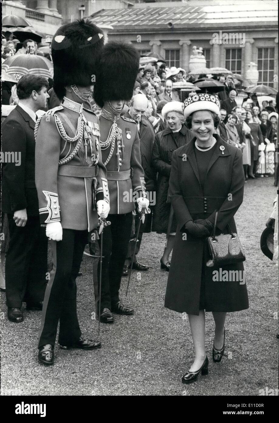 Apr. 04, 1977 - The Queen Presents New Colors to the First Battalion Scots Guards. This morning in Buckingham Palace Gardens the Queen presented new colors to the First Battalion Scots Guards of which she is Colonel in Chief of the Regiment. Photo shows The Queen seen leaving the parade after presenting the new colors , on the left is the Duke of Kent. Stock Photo