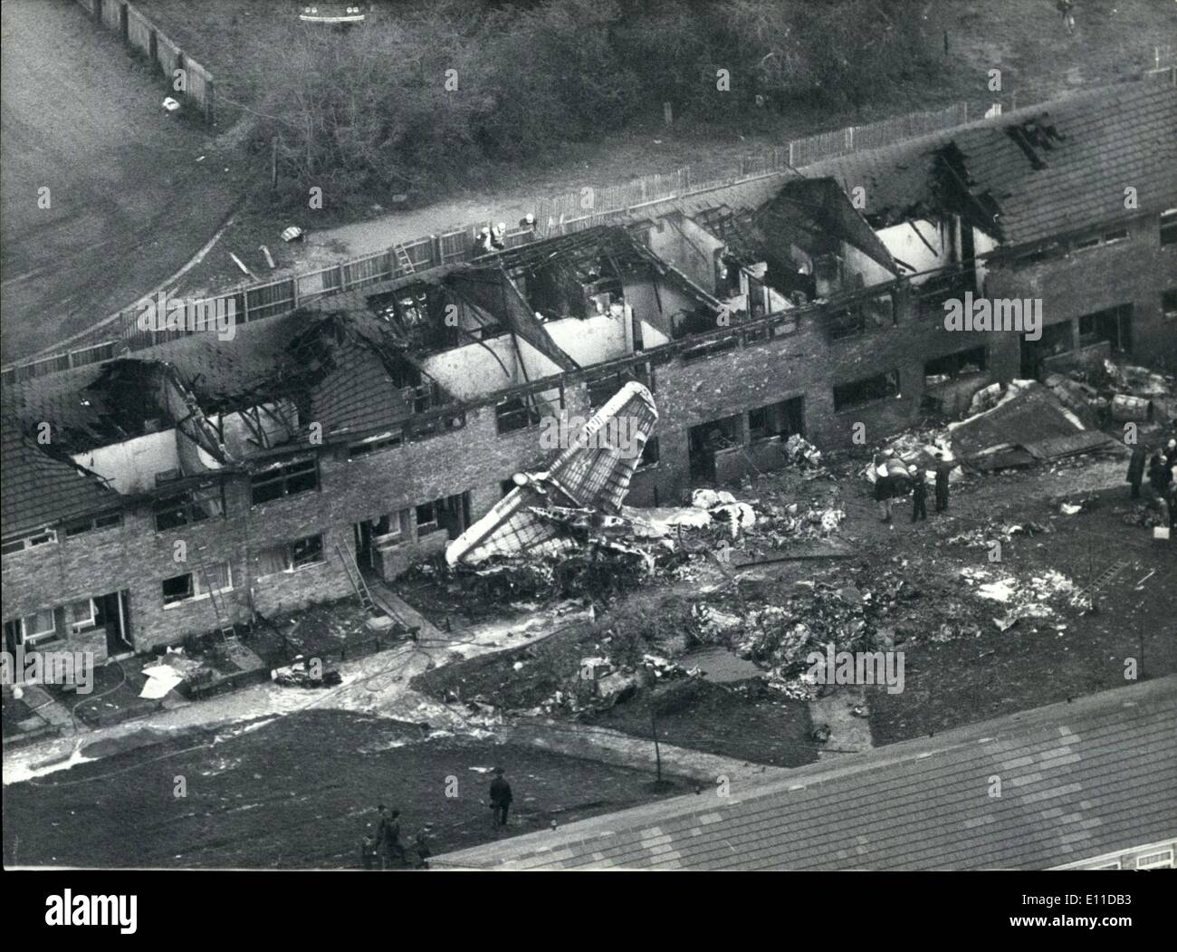 May 05, 1977 - Five dies as plane hits homes: An RAF Canberra crashed on a row of houses of the council estate Huntingdon, Norfolk, killing the crew of two and three children one of the children was a four month old baby boy, and the other two were sisters aged two and four. The plane which was returning from a photo-reconnaissance flight over Scotland and was withing two miles of its home base at Wyton when for no apparent reason it went out of control, falling on a row of houses in Norfolk Street, Hartford, which is alongside the air base Stock Photo